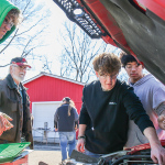 High school auto shop students fix cars for people in need